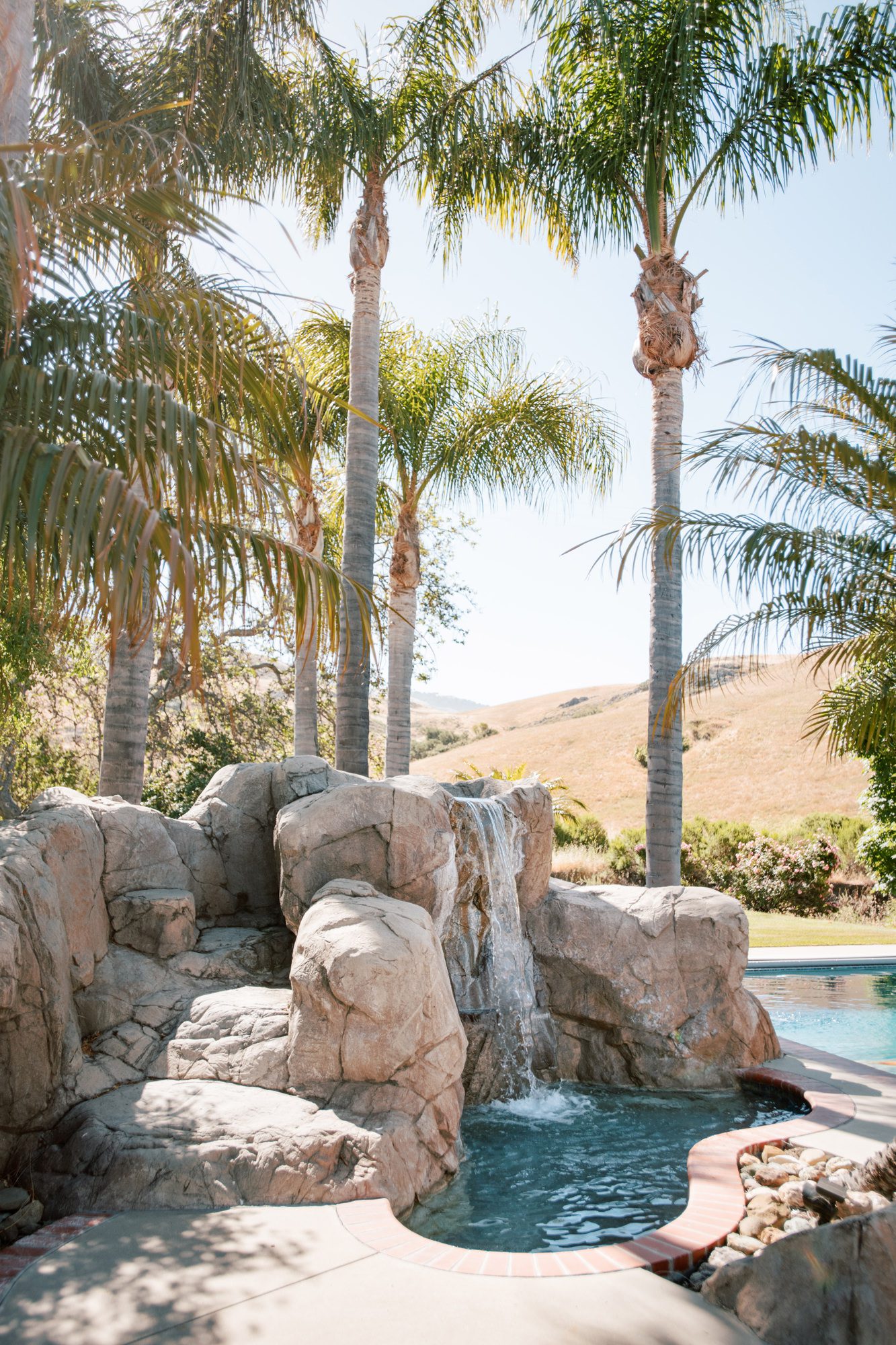 Luxury pool and hot tub with slide at Higuera Ranch airbnb luxury house rental surrounded by the san luis obispo hills, two minutes from downtown SLO