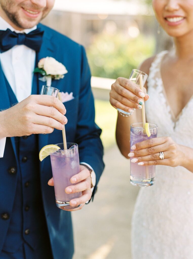 purple and pink cocktails at luxurious jewish wedding at San Luis Obispo Wedding Venue Higuera Ranch photographed by Fine Art Film Photographer Tina Loveridge of Loveridge Photography