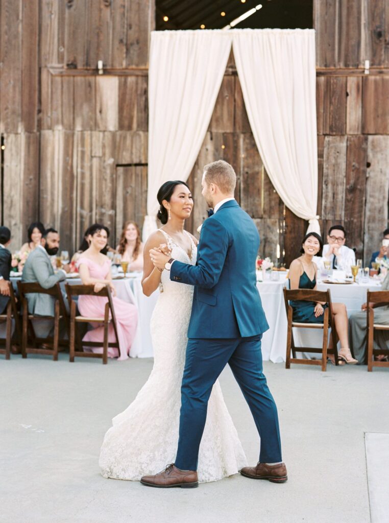 sharing first dance at luxurious jewish wedding at San Luis Obispo Wedding Venue Higuera Ranch photographed by Fine Art Film Photographer Tina Loveridge of Loveridge Photography