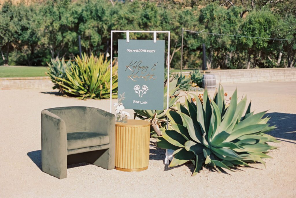 Wedding welcome sign and avenue twelve luxury seating during wedding weekend in the san lucia mountain range at luxury san luis obispo wedding venue Higuera Ranch photographed by Jessica Sofranko Photography